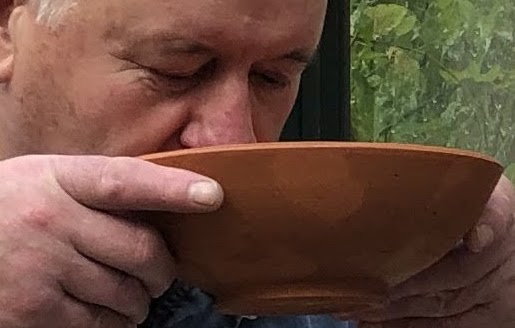 Bill drinking from the bowl